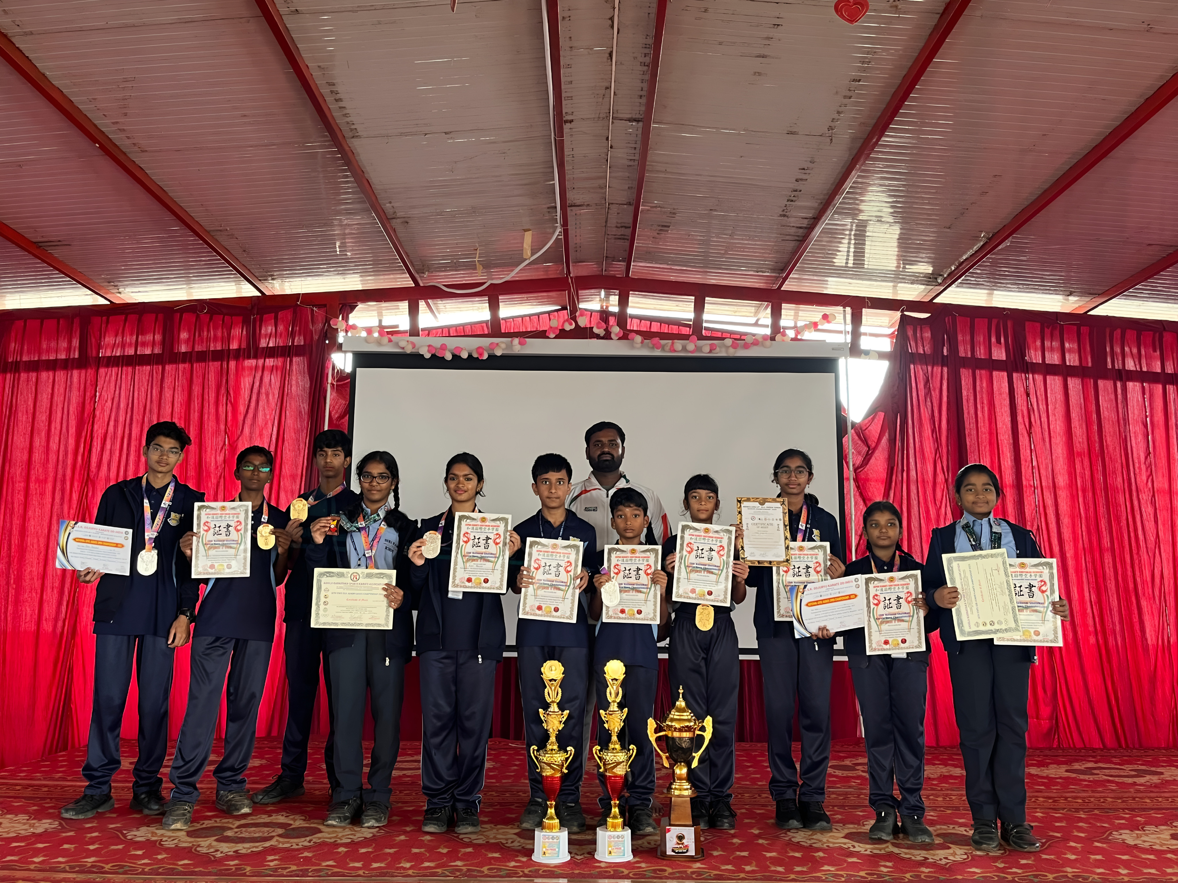 National Shotokan team winners with certificates and trophies